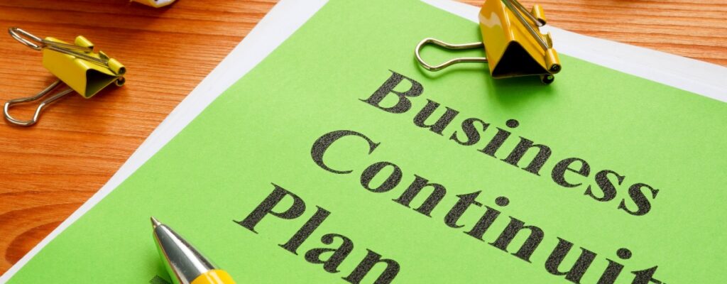 a green piece of paper with the words "business continuity planning" written on it